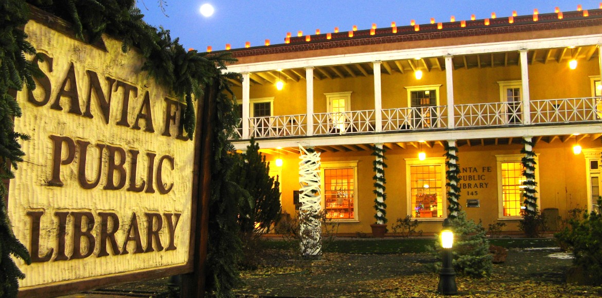 Main Library sign and exterior of building with holiday decorations