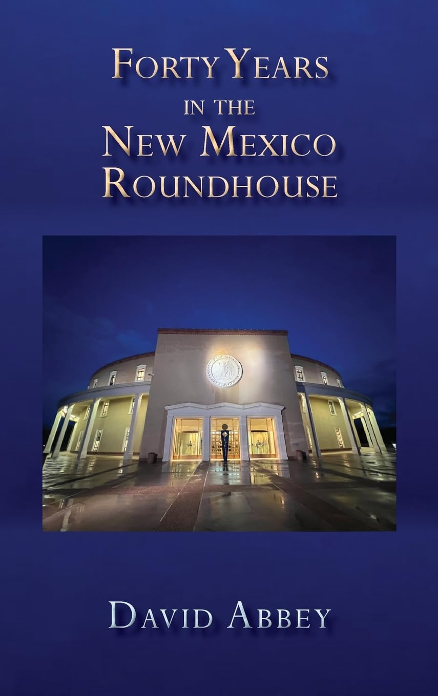 Dark blue book cover with image of New Mexico State Roundhouse and text that reads "Forty Years in the New Mexico Roundhouse, David Abbey"