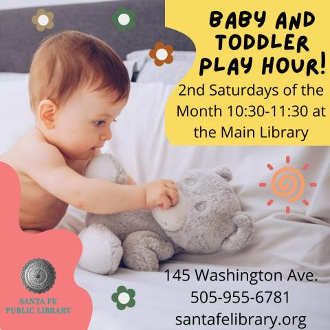 Photo image of a baby playing with a teddy bear 