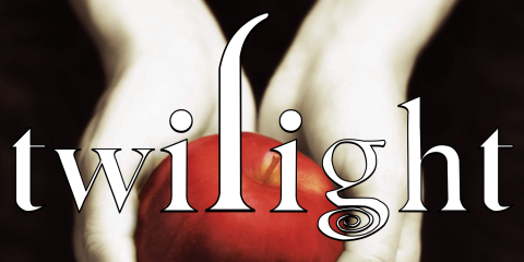Twilight Book Cover, black background with pale hands holding a red apple