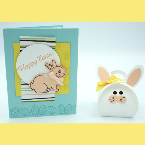 A handmade "Happy Easter" card featuring a bunny and a matching bunny-shaped gift box with a yellow ribbon.