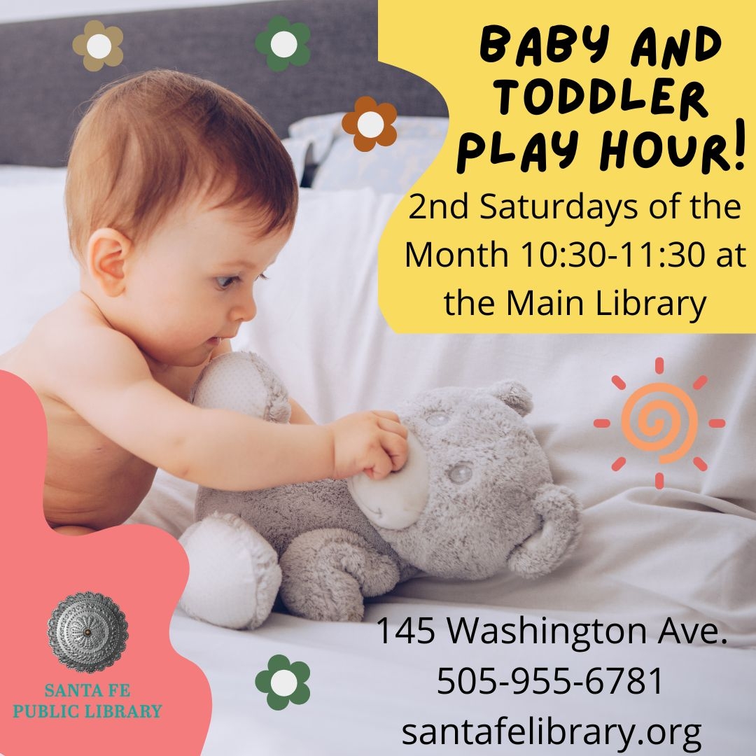 Photo image of a baby playing with a teddy bear 