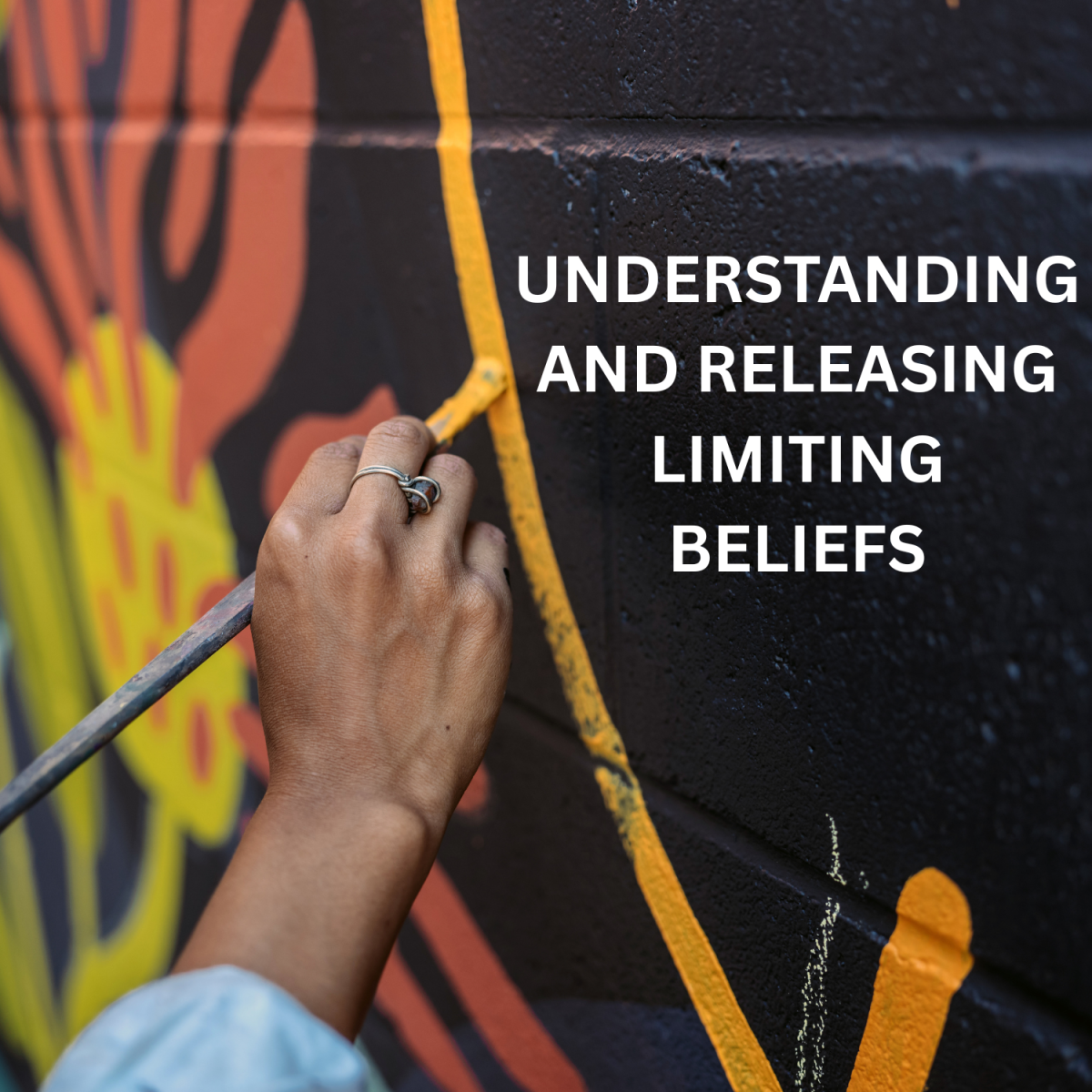 hand painting a yellow line with text that reads "Understanding and Releasing Limiting Beliefs"