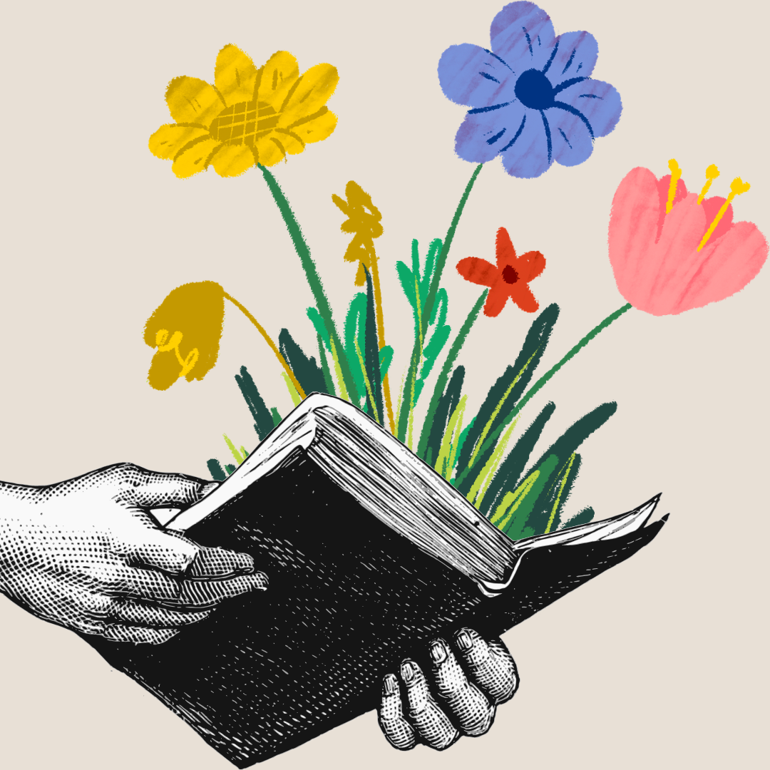 A black book is held open, with colorful flowers and green leaves sprouting from its pages.