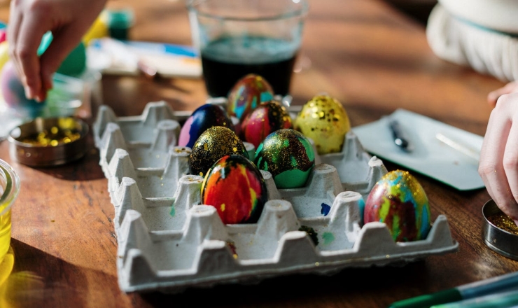 Painted/colored eggs in egg carton