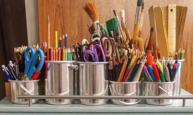 Tin containers of art supplies